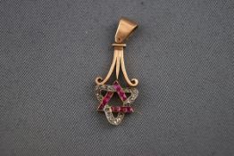 An early 20th century rose gold, ruby and diamond pendant,