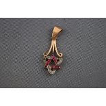 An early 20th century rose gold, ruby and diamond pendant,