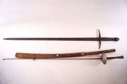 A Continental sword with scabbard, the blade 92cm long,
