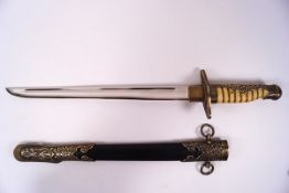 A European dress dagger and sheath with ornately decorated brass mounts and shagreen effect handle