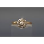 An early 20th century gold and diamond nine stone cluster ring, the old-cut stones approx. 0.