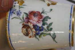 A Sevres chocolate cup, cover and trembleuse saucer, painted with flower sprays,