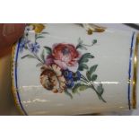 A Sevres chocolate cup, cover and trembleuse saucer, painted with flower sprays,