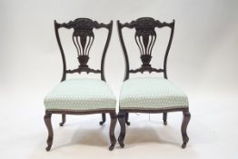 A pair of Victorian stained mahogany nursing chairs,