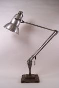 A Herbert Terry anglepoise lamp on a stepped square base