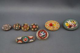 A collection of early 20th century gilt-metal and micro-mosaic jewels, each depicting flowers,