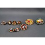 A collection of early 20th century gilt-metal and micro-mosaic jewels, each depicting flowers,