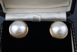 A pair of large mabe pearl earrings, each approx.
