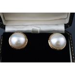 A pair of large mabe pearl earrings, each approx.