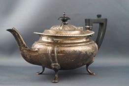 A silver small oval tea pot with a gadrooned rim, shaped corners,