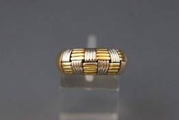 A modern Italian bi-colour tapering band ring, the head in the form a reeded 'chequerboard' design,