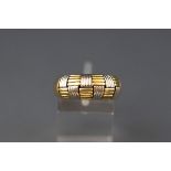 A modern Italian bi-colour tapering band ring, the head in the form a reeded 'chequerboard' design,