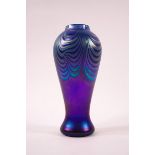 A Studio glass vase by Okra, marbling effect to a blue iridescent ground,