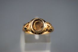 An early Victorian 18ct gold and enamel mourning ring,