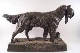 After J Moigniez, bronze of a spaniel with dead game on a rectangular base, signed J Moigniez,