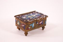 A decorative brass stamp box, painted with enamel scroll and foliate decoration, 5.