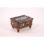 A decorative brass stamp box, painted with enamel scroll and foliate decoration, 5.