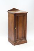 A Victorian mahogany pot cupboard, the front with carved reeded detail,