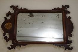 A 19th century mahogany fretwork wall mirror with gilt shell carving,