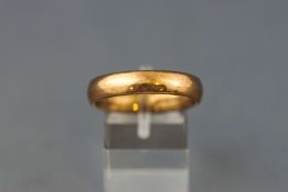 A yellow gold D shape wedding ring 5mm size: U Hallmarked 9ct gold, London, 1998 5.
