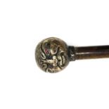 A Victorian walking cane with a silver 'Man in the Moon' knop,