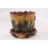 A Donyatt pottery planter with green and yellow textured bark effect, 17cm high and a matching dish,