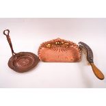 A group of Arts & Crafts copper ware: crumb scoop and brush, oval dish, circular dish,