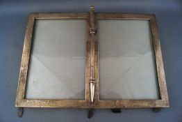 An Edwardian silver rectangular double photograph frame, with central pen holder, London 1901,