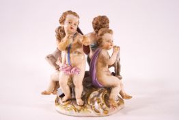 A 19th century Meissen figural group of four children depicting The Arts on a C-scroll base,