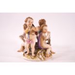 A 19th century Meissen figural group of four children depicting The Arts on a C-scroll base,