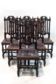 A set of six Victorian oak dining chairs with carved and barley twist backs and leatherette seats