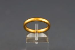 A 22 carat gold wedding band. Width: 3.2mm depth: 2.4mm Size: L 1/2 6.