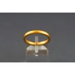 A 22 carat gold wedding band. Width: 3.2mm depth: 2.4mm Size: L 1/2 6.