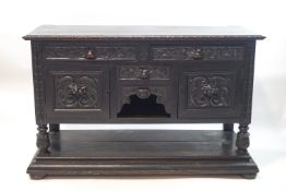 A Victorian oak sideboard with lion carved drawers above cupboard doors and a single drawer,