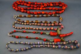 Five various bead necklaces comprising: an abstract coral,