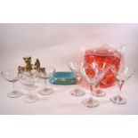 A collection of Babycham memorabilia including brass Bambi ornaments, two sets of four glasses,