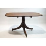 A 19th century mahogany rectangular tilt top table on splayed legs,