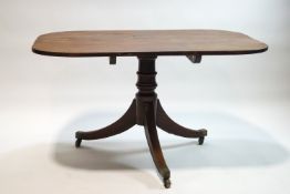 A 19th century mahogany rectangular tilt top table on splayed legs,