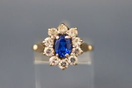 A 1960's 9ct gold, blue and colourless stone oval cluster ring, London 1967, size N+, 3.