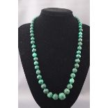 A malachite graduated off-round bead single row necklace, approx.