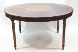 A French circular mahogany dining table,