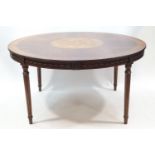 A French circular mahogany dining table,