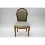 A French style gilded side chair with duck egg blue patterned upholstery on fluted legs