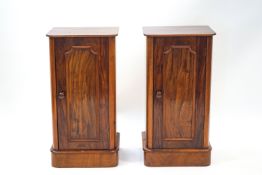 A pair of Victorian mahogany pot cupboards with panel doors, 75cm high x 39cm wide x 32.