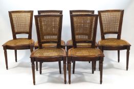 A set of six French mahogany caned dining chairs on fluted legs (matches lot 527)