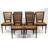 A set of six French mahogany caned dining chairs on fluted legs (matches lot 527)