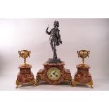 A French rouge marble clock garniture with eight day movement,