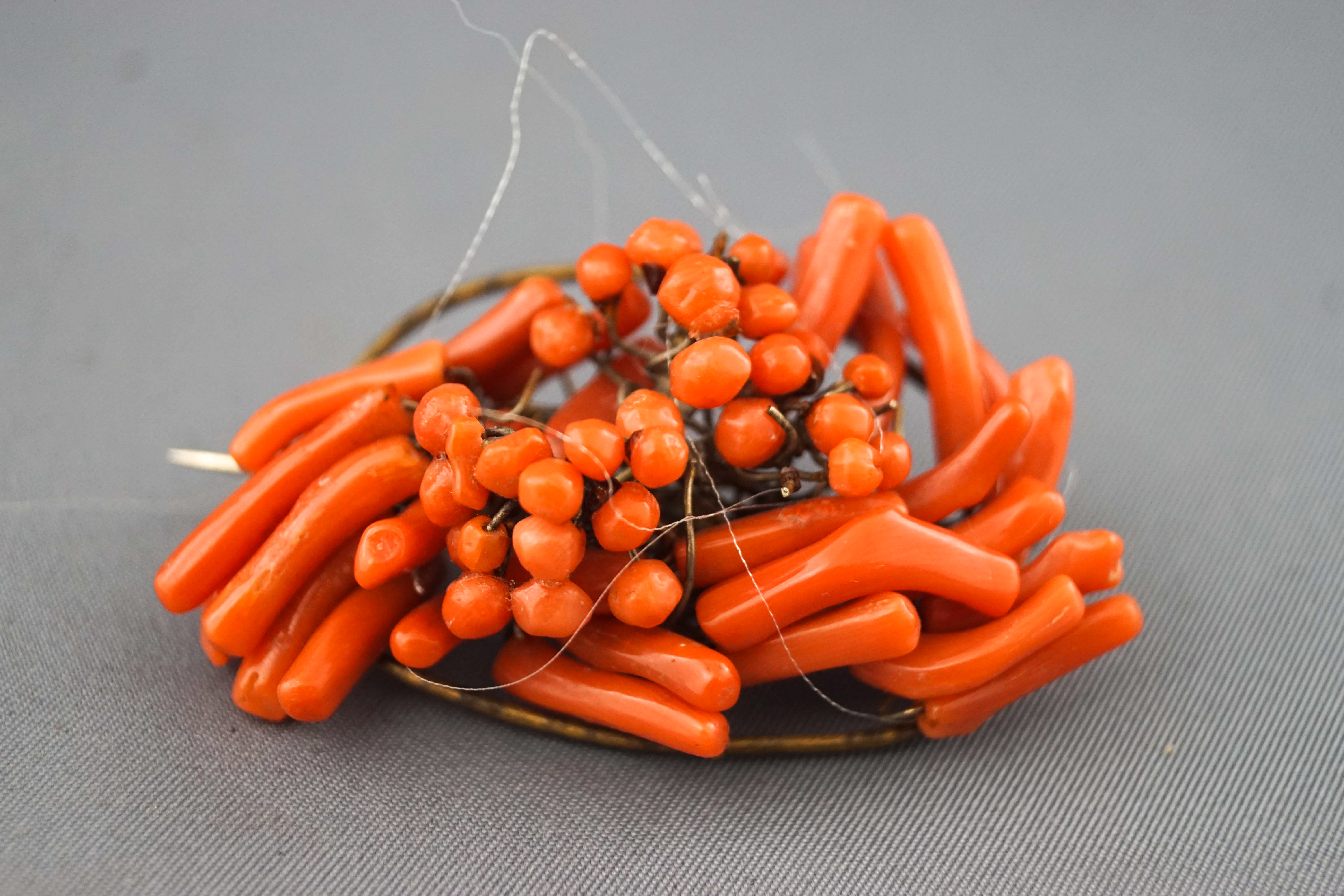 An early 20th century coral abstract cluster brooch of oval outline set with branches and beads, - Image 2 of 2