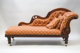A Victorian mahogany show frame chaise longue with button back,