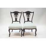 A pair of Victorian stained mahogany nursing chairs,